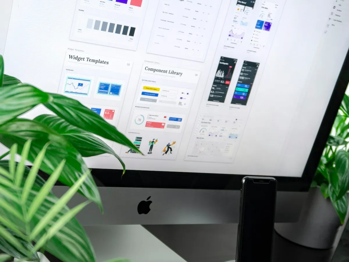 Meridian website layouts displayed on a designer's monitor